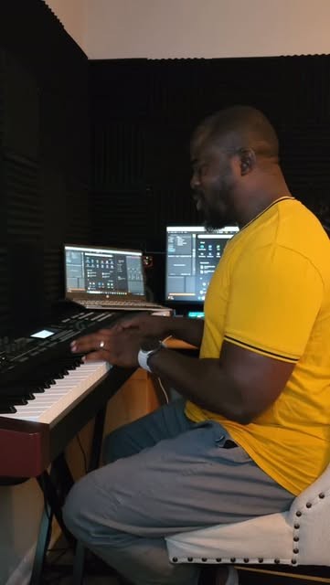 Soji at the keyboard in a studio
