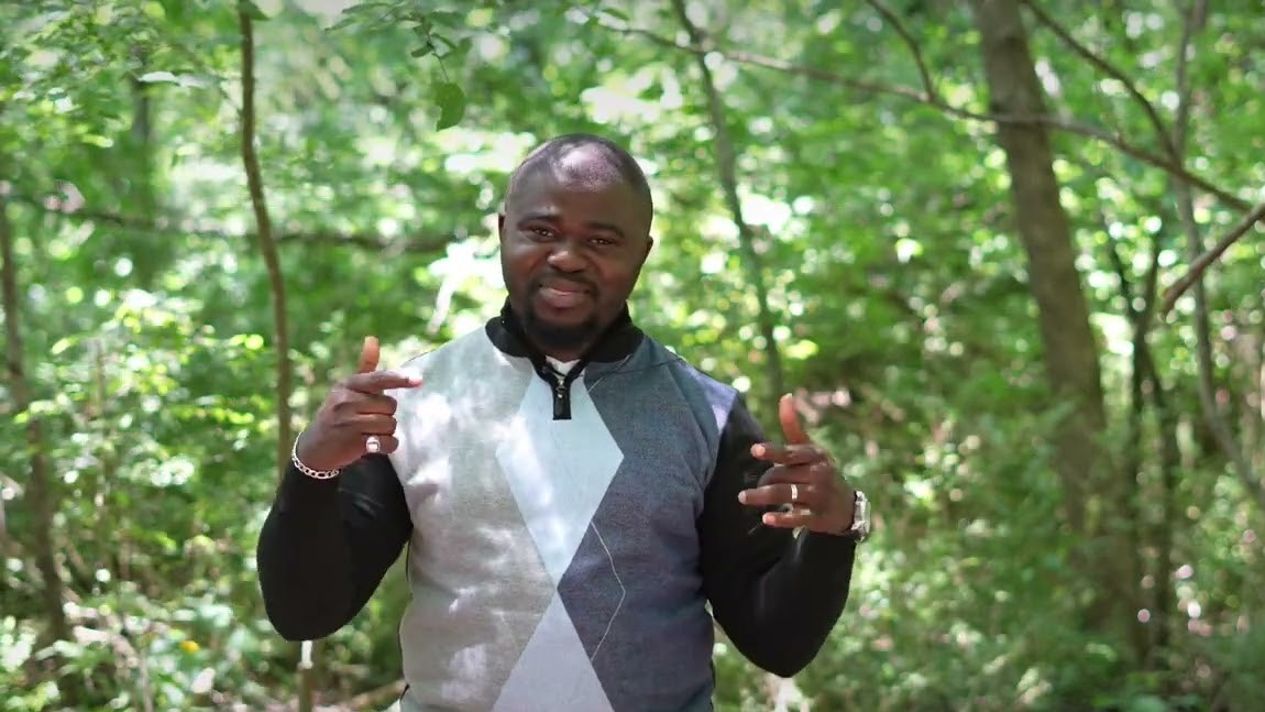 Soji singing among trees, outdoors